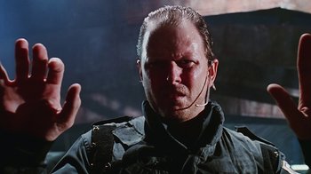 Movie still from “Hellraiser: Bloodline” (1996), directed by Kevin Yagher – A person wearing a headset; Close Up shot, Low angle