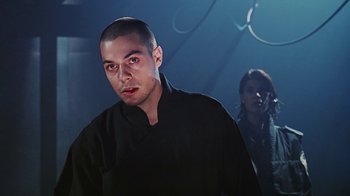 Movie still from “Hellraiser: Bloodline” (1996), directed by Kevin Yagher – A man and a woman standing next to each other; Close Up shot, Low angle