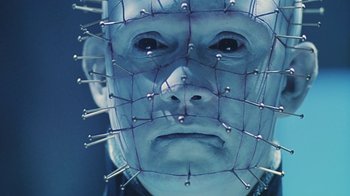 Movie still from “Hellraiser: Bloodline” (1996), directed by Kevin Yagher – A man's face with pins on his head; Close Up shot, Low angle