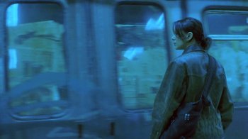Movie still from “Hellraiser: Deader” (2005), directed by Rick Bota – A woman is standing in front of a train window; Medium shot, Low angle