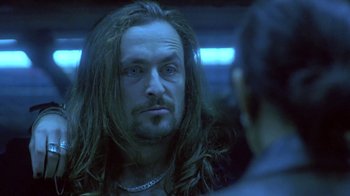 Movie still from “Hellraiser: Deader” (2005), directed by Rick Bota – A person with long hair; Close Up shot, Over the shoulder angle