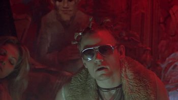 Movie still from “Hellraiser: Deader” (2005), directed by Rick Bota – A man in a fur jacket and sunglasses; Close Up shot, Low angle