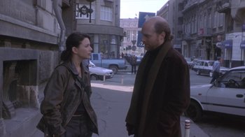 Movie still from “Hellraiser: Deader” (2005), directed by Rick Bota – A man and a woman standing on the side of the street; Medium shot, Over the shoulder angle