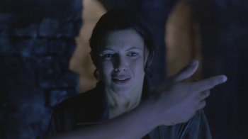 Movie still from “Hellraiser: Deader” (2005), directed by Rick Bota – A woman is looking at the camera with her hand extended; Close Up shot, Over the shoulder angle