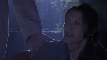 Movie still from “Hellraiser: Deader” (2005), directed by Rick Bota – A woman sitting in a car next to a man; Close Up shot, Over the shoulder angle