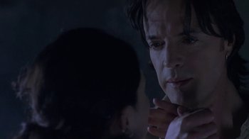 Movie still from “Hellraiser: Deader” (2005), directed by Rick Bota – A person looking at the camera; Close Up shot, Over the shoulder angle