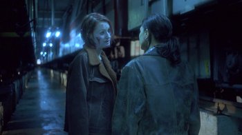 Movie still from “Hellraiser: Deader” (2005), directed by Rick Bota – Two women standing next to each other on the street; Medium shot, Over the shoulder angle