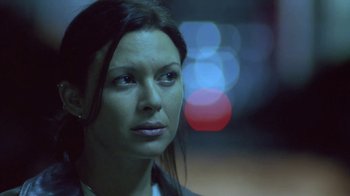 Movie still from “Hellraiser: Deader” (2005), directed by Rick Bota – A woman's face in the dark; Close Up shot, Low angle