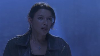 Movie still from “Hellraiser: Deader” (2005), directed by Rick Bota – A woman in a leather jacket looking at the camera; Close Up shot, Low angle