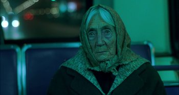 Movie still from “Hellraiser: Hellseeker” (2002), directed by Rick Bota – An old woman wearing a scarf and a jacket; Close Up shot, Low angle
