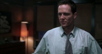 Movie still from “Hellraiser: Hellseeker” (2002), directed by Rick Bota – A person wearing a shirt and a tie; Close Up shot, Low angle