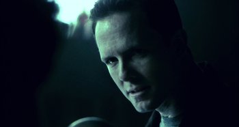 Movie still from “Hellraiser: Hellseeker” (2002), directed by Rick Bota – A person in a dark room; Close Up shot, Over the shoulder angle