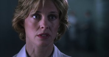 Movie still from “Hellraiser: Hellseeker” (2002), directed by Rick Bota – A person wearing a white lab coat; Close Up shot, Low angle