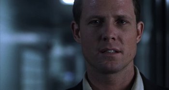 Movie still from “Hellraiser: Hellseeker” (2002), directed by Rick Bota – A person wearing a suit and tie; Close Up shot, Over the shoulder angle