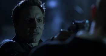 Movie still from “Hellraiser: Hellseeker” (2002), directed by Rick Bota – A person taking a picture with a cell phone; Close Up shot, Over the shoulder angle