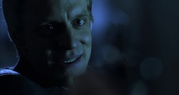 Movie still from “Hellraiser: Hellseeker” (2002), directed by Rick Bota – A man's face in the dark; Close Up shot, Over the shoulder angle