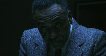 Movie still from “Hellraiser: Hellseeker” (2002), directed by Rick Bota – A person wearing a suit and tie; Close Up shot, High angle