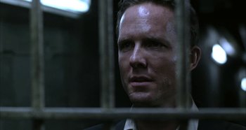 Movie still from “Hellraiser: Hellseeker” (2002), directed by Rick Bota – A person behind a fence; Close Up shot, Low angle