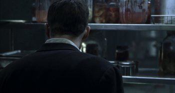 Movie still from “Hellraiser: Hellseeker” (2002), directed by Rick Bota – A man standing in front of an open refrigerator; Close Up shot, Over the shoulder angle