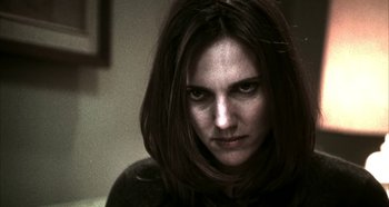 Movie still from “Hellraiser: Hellseeker” (2002), directed by Rick Bota – A person with long dark hair; Close Up shot, Over the shoulder angle