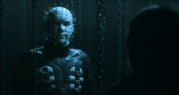 Movie still from “Hellraiser: Hellseeker” (2002), directed by Rick Bota – A man in a uniform is looking into a mirror; Close Up shot, Low angle