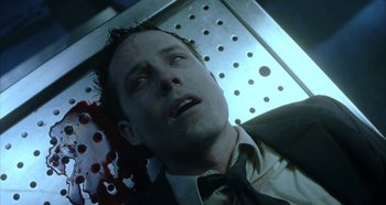 Movie still from “Hellraiser: Hellseeker” (2002), directed by Rick Bota – A person in a suit and tie; Close Up shot, Overhead angle