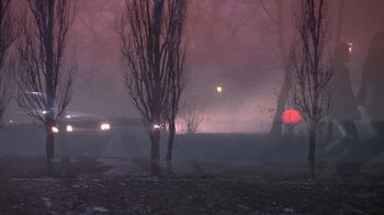 Movie still from “Hellraiser: Hellworld” (2005), directed by Rick Bota – A car is parked in a parking lot on a foggy night; Extreme Wide shot, Low angle
