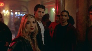 Movie still from “Hellraiser: Hellworld” (2005), directed by Rick Bota – A group of young people standing in a room together; Medium shot, Low angle