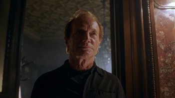 Movie still from “Hellraiser: Hellworld” (2005), directed by Rick Bota – An older man is looking at the camera; Close Up shot, Low angle