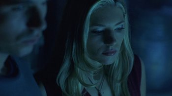 Movie still from “Hellraiser: Hellworld” (2005), directed by Rick Bota – A woman with long blonde hair looking down at her face; Close Up shot, Low angle