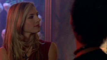 Movie still from “Hellraiser: Hellworld” (2005), directed by Rick Bota – A woman in a red dress talking to a man in a red shirt; Close Up shot, Over the shoulder angle