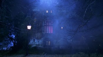 Movie still from “Hellraiser: Hellworld” (2005), directed by Rick Bota – A lamp post in front of an old building; Extreme Wide shot, Low angle