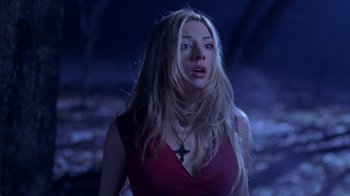 Movie still from “Hellraiser: Hellworld” (2005), directed by Rick Bota – A woman with long blonde hair wearing a red top; Medium shot, Low angle