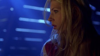 Movie still from “Hellraiser: Hellworld” (2005), directed by Rick Bota – A woman with long blonde hair looking to her left; Close Up shot, Low angle