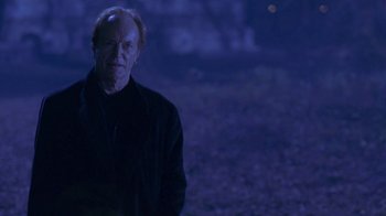 Movie still from “Hellraiser: Hellworld” (2005), directed by Rick Bota – An old man standing in the dark at night; Medium shot, Low angle