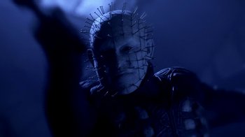 Movie still from “Hellraiser: Hellworld” (2005), directed by Rick Bota – A man in a uniform with a face covered in spikes; Close Up shot, Low angle