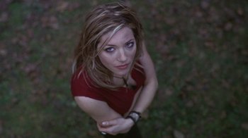Movie still from “Hellraiser: Hellworld” (2005), directed by Rick Bota – A beautiful young woman in a red shirt; Close Up shot, Overhead angle