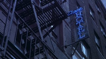 Movie still from “Hellraiser: Hellworld” (2005), directed by Rick Bota – A hotel sign on the side of a building; Wide shot, Low angle