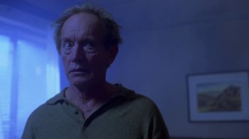 Movie still from “Hellraiser: Hellworld” (2005), directed by Rick Bota – An older man is looking into the distance; Close Up shot, Low angle