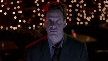 Movie still from “Hellraiser: Inferno” (2000), directed by Scott Derrickson – A person wearing a suit and tie; Close Up shot, Low angle