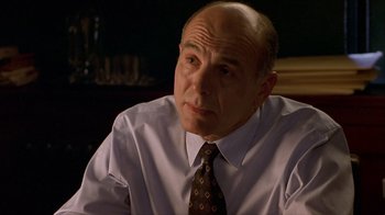 Movie still from “Hellraiser: Inferno” (2000), directed by Scott Derrickson – A man in a white dress shirt and a tie; Close Up shot, Low angle