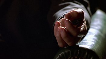 Movie still from “Hellraiser: Inferno” (2000), directed by Scott Derrickson – A person holding their hand out to someone; Extreme Close Up shot, High angle