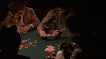 Movie still from “Hellraiser: Inferno” (2000), directed by Scott Derrickson – A group of people sitting at a table playing poker; Medium shot, High angle