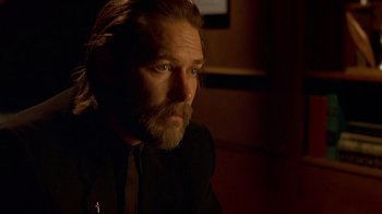 Movie still from “Hellraiser: Inferno” (2000), directed by Scott Derrickson – A person with a beard; Close Up shot, Over the shoulder angle