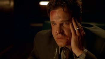 Movie still from “Hellraiser: Inferno” (2000), directed by Scott Derrickson – A person wearing a suit and tie; Close Up shot, High angle
