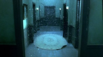 Movie still from “Hellraiser: Inferno” (2000), directed by Scott Derrickson – A rug in the middle of a hallway covered in snow; Wide shot, High angle