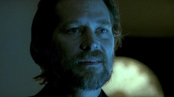 Movie still from “Hellraiser: Inferno” (2000), directed by Scott Derrickson – A person with a beard looking at the camera; Close Up shot, Low angle