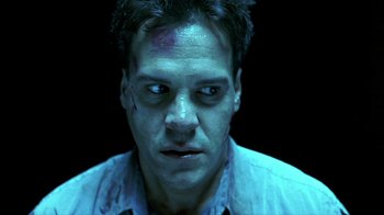 Movie still from “Hellraiser: Inferno” (2000), directed by Scott Derrickson – A person with a bruise on his face; Close Up shot, Low angle