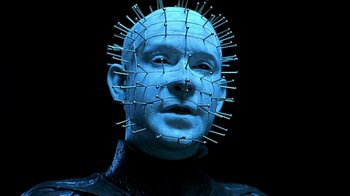 Movie still from “Hellraiser: Inferno” (2000), directed by Scott Derrickson – A man with a pinhead mask on his head; Close Up shot, Low angle