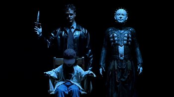 Movie still from “Hellraiser: Inferno” (2000), directed by Scott Derrickson – A group of people standing next to each other in the dark; Medium shot, Low angle
